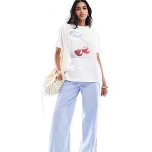 White Graphic T-Shirt with Blue Striped Pants